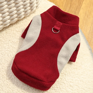 Detail of red and grey fleece pet vest with integrated metal D-ring for leash attachment