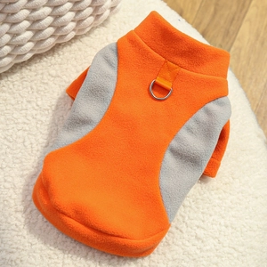 Detail of warm fleece pet vest with orange and gray panels and sturdy metal D-ring for leash