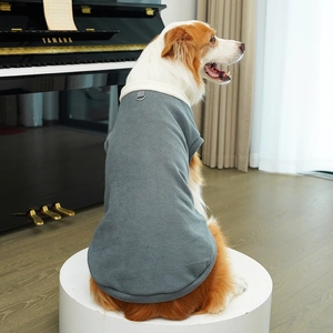 Detail of warm grey-green fleece dog vest with built-in metal D-ring for leash attachment