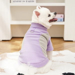 Detail of warm fleece pet vest featuring dual-tone purple gray fabric and metal D-ring attachment