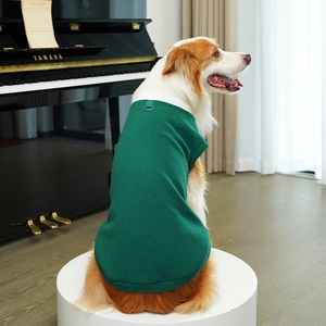 Detail of green fleece dog vest with white collar and metal D-ring for leash attachment
