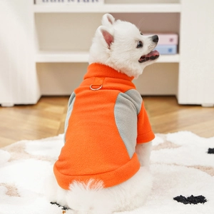 Detail of dog fleece sweater with metal D-ring for leash attachment in orange and grey