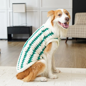 Detail of green and white wavy pattern fleece pet vest for large dogs in a home setting