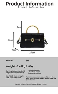 Detail of black faux leather handbag with crocodile pattern and golden spiral handle