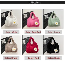 Detail view of large plush tote bags in multiple colors with daisy charm accessory
