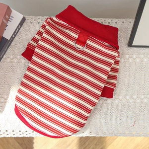 Detail of red and white striped pet sweater showing the metal D-ring and knit texture