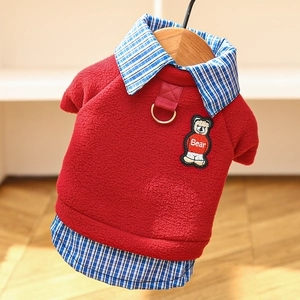 Detail of red fleece pet sweatshirt featuring bear embroidery and a metal D-ring attachment