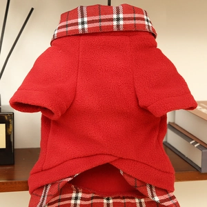 Detailed view of red polar fleece pet jacket with classic plaid pattern collar and hem
