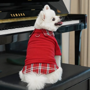 Detail of red plaid dog fleece hoodie with integrated metal D-ring for leash attachment