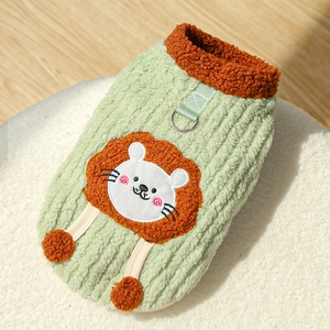 Detail of warm green pet vest featuring orange lion patch embroidery and a metal D-ring