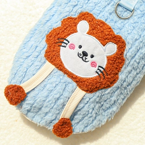 Close-up of light blue sherpa fleece pet vest featuring a cute cartoon lion embroidery