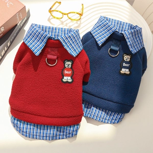 Detail of fleece pet hoodies in red and navy featuring bear embroidery and D-ring