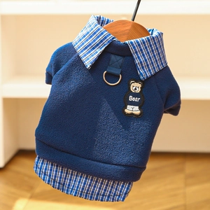 Detail of dark blue fleece pet hoodie with a bear embroidery and built-in D-ring