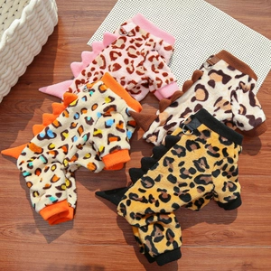 Detail of plush pet hoodies featuring leopard print, dinosaur fins, and metal D-rings