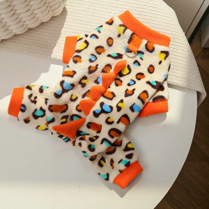 Detail of plush dinosaur pet onesie with leopard print and 3D spikes for winter warmth