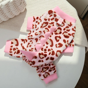 Close-up of pink leopard print pet hoodie with plush dinosaur spikes and metal D-ring