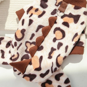 Detail of leopard print pet vest featuring plush fabric and dinosaur spine decor with D-ring