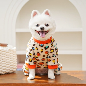 Detailed view of colorful leopard print pet fleece jacket on a small white Pomeranian
