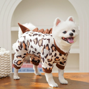 Close-up of leopard print pet pajamas with soft plush fabric and dinosaur spine detail