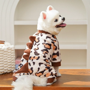 Detail of leopard print pet fleece jumpsuit with dinosaur spikes and metal D-ring attachment