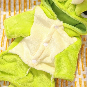 Detail of soft green flannel pet dinosaur costume with white snap button closure