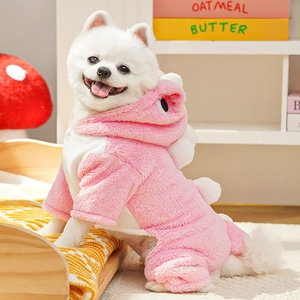 Detail of pink dinosaur fleece pet costume featuring soft spines and button closure