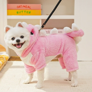 Detailed view of soft pink dinosaur pet onesie with plush fabric and white back fins