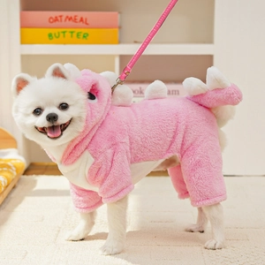Detailed macro view of pink dinosaur fleece dog onesie with soft plush texture and hood