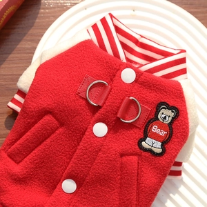 Detail of red fleece pet baseball jacket with soft lining and metal D-rings for harness