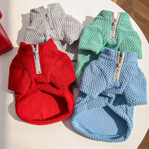 Detail of multi-color pet sweaters with herringbone texture and half-zipper design