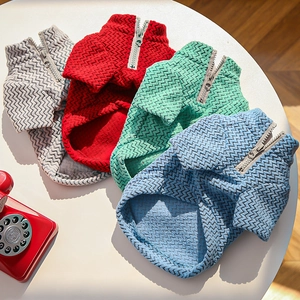 Close-up of pet zipper coats in four colors with textured herringbone wave pattern