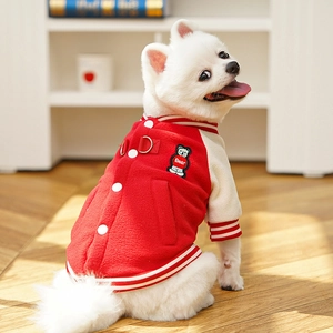 Close-up of red and beige fleece pet baseball jacket with D-ring and bear embroidery