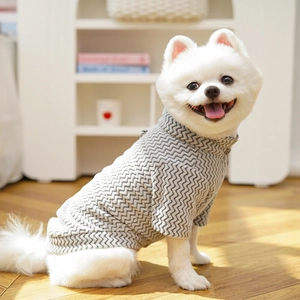 Close-up of grey and white wavy knit pattern on a warm high-neck pet sweater