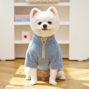 Detail of light blue herringbone knit pet sweater with a stylish half-zip stand collar