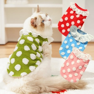 Close-up of soft polka dot pet fleece vest featuring white lace collar and a metal D-ring