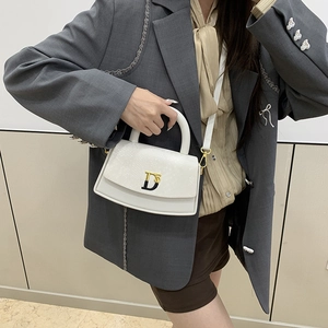 White box-shaped handbag with snake texture flap and gold D-letter buckle detail