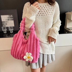Pink plush tote bag with floral detail and soft vertical texture for women