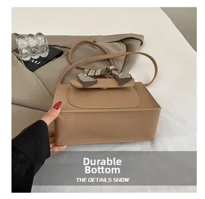 Detailed view of the wear-resistant bottom on tan vintage leather handbag for women