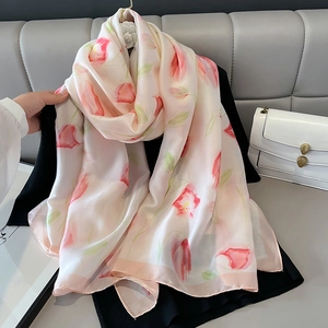 Elegant silk-like tulip scarf in creamy white and pink, perfect for beach sun protection