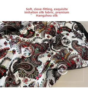 Close-up of ethnic paisley print silk-like fabric showing soft texture and breathability