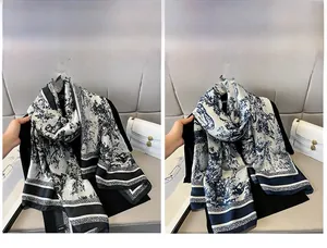 Detail of vintage silk scarves featuring French Toile de Jouy prints in black and navy