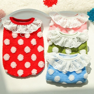 Close-up of soft flannel pet vests with lace collars and polka dots in four bright colors