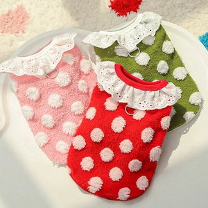 Close-up of warm fleece pet vests with white polka dots, lace collar, and metal D-rings