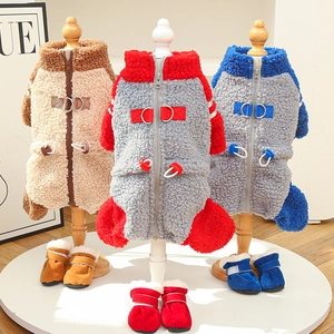 Close-up of winter fleece pet vest and matching soft booties on miniature displays