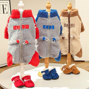 Detailed view of fleece pet vests with zippers and D-rings in multiple colors