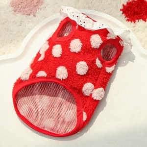 Close-up of red polka dot fleece dog vest with delicate white lace collar detail
