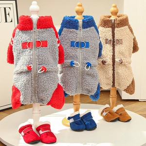 Fleece dog jumpsuits in three colors with matching snow boots and harness D-rings