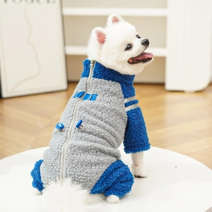 Detail of dog winter fleece jumpsuit with back zipper and blue D-ring on white Pomeranian