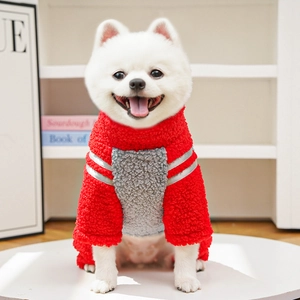 Detail of red and gray dog fleece sweater featuring reflective stripes and soft warm fabric