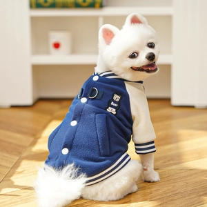Detail of navy dog baseball jacket featuring bear embroidery and D-ring for leash